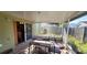 Screened-in patio, perfect for outdoor seating and enjoying the fresh air while being protected from the elements at 1810 Rudder Dr, Valrico, FL 33594