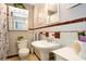 Bathroom featuring a pedestal sink, and tiled walls at 1813 5Th W St, Palmetto, FL 34221