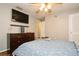 Bedroom with a ceiling fan and dresser at 1813 5Th W St, Palmetto, FL 34221