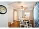 Bright dining room featuring a ceiling fan and a view into the kitchen at 1813 5Th W St, Palmetto, FL 34221