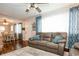 Cozy living space with ample seating, hardwood flooring, and natural light at 1813 5Th W St, Palmetto, FL 34221
