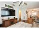 Open-concept living area with hardwood floors and a decorative 'HOME' wall art at 1813 5Th W St, Palmetto, FL 34221