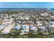 Island home situated waterfront with private dock and boat lift, offering scenic neighborhood views at 216 Archer Way, Anna Maria, FL 34216