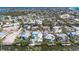 Waterfront homes feature backyard pools and canal access with boat lift on the water at 216 Archer Way, Anna Maria, FL 34216
