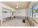 Spacious bedroom featuring two closets and a sun-filled window at 216 Archer Way, Anna Maria, FL 34216
