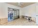 Bedroom during renovation featuring a tile floor with an open doorway to another area and natural light at 216 Archer Way, Anna Maria, FL 34216