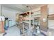This is a cluttered garage with a workbench and storage space at 216 Archer Way, Anna Maria, FL 34216