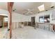 Bright kitchen during renovation boasting a skylight, ceiling fan, and sliding glass door to outside area at 216 Archer Way, Anna Maria, FL 34216