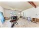 Bright and airy living room with tile flooring, undergoing renovations with visible studs and exposed beams at 216 Archer Way, Anna Maria, FL 34216