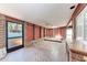 Sunroom with skylight, exposed brick wall, and outdoor access at 216 Archer Way, Anna Maria, FL 34216