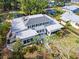 Stunning aerial view of home with lush landscaping, white exterior, and elegant green shutters at 2326 2Nd E Ave, Bradenton, FL 34208