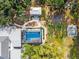 Aerial shot highlighting the pool and the pathways through the lush backyard at 2326 2Nd E Ave, Bradenton, FL 34208