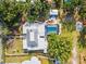 Aerial view showcasing the pool, chess board, and lush landscaping surrounding the property at 2326 2Nd E Ave, Bradenton, FL 34208