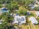 Expansive aerial view featuring a backyard pool and the home's proximity to mature trees and neighborhood streets at 2326 2Nd E Ave, Bradenton, FL 34208