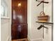 Functional closet space featuring a built-in cabinet, shelves, and rods for optimal organization and storage at 2326 2Nd E Ave, Bradenton, FL 34208
