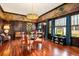 Elegant dining room with unique wall mural and hardwood floors at 2326 2Nd E Ave, Bradenton, FL 34208