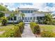 Charming home with a walkway lined with green bushes leading to the front entrance at 2326 2Nd E Ave, Bradenton, FL 34208