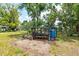 Outdoor gardening station with potting bench, shelving, and water source, ideal for plant enthusiasts at 2326 2Nd E Ave, Bradenton, FL 34208