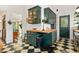 This kitchen features checkerboard floors, wood countertops and unique green cabinetry at 2326 2Nd E Ave, Bradenton, FL 34208