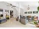 Bright living room with wicker furniture, ceiling fan and unique decor at 2326 2Nd E Ave, Bradenton, FL 34208