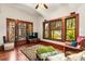 Living room with hardwood floors, decorative trim, and large windows at 2326 2Nd E Ave, Bradenton, FL 34208