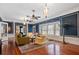 Open living room with hardwood floors, large windows, and neutral furniture offer a bright and inviting space at 2326 2Nd E Ave, Bradenton, FL 34208