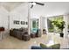 Cozy living area with ceiling fan, white wood beams and access to outdoor pool at 2326 2Nd E Ave, Bradenton, FL 34208