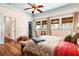 Spacious bedroom featuring wood floors, ceiling fan, large windows and a walk-in closet at 2326 2Nd E Ave, Bradenton, FL 34208