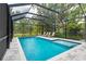 Covered pool area with lounge chairs at 2326 2Nd E Ave, Bradenton, FL 34208