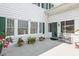 Cozy porch area featuring seating, decorative pots, and architectural details that enhance curb appeal at 2326 2Nd E Ave, Bradenton, FL 34208