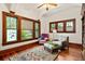 Inviting sitting room boasts hardwood floors, bright windows, and stylish decor at 2326 2Nd E Ave, Bradenton, FL 34208
