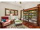 Bright sitting room with hardwood floors, stylish area rug, and ample natural light at 2326 2Nd E Ave, Bradenton, FL 34208