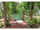 Storage shed in wooded area surrounded by mulch at 2326 2Nd E Ave, Bradenton, FL 34208