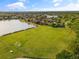 Beautiful community featuring a large green space with soccer goals and a serene lake for outdoor activities at 244 Dove Trl, Bradenton, FL 34212