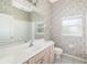 Bathroom featuring a large mirror, a window, and a walk-in shower at 244 Dove Trl, Bradenton, FL 34212