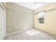 Bedroom with carpet, wallpaper and window providing natural light and outdoor views at 244 Dove Trl, Bradenton, FL 34212