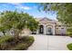 Charming home featuring a well-manicured front yard, tiled roof and welcoming entrance at 244 Dove Trl, Bradenton, FL 34212