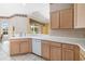 Spacious kitchen with bright countertops, stainless steel dishwasher, and wooden cabinets at 244 Dove Trl, Bradenton, FL 34212