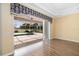 Open living area with sliding glass doors to a screened lanai and pool, offering seamless indoor-outdoor living at 244 Dove Trl, Bradenton, FL 34212