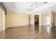 Spacious living room boasts beautiful wood floors, tray ceilings, and access to the outside at 244 Dove Trl, Bradenton, FL 34212