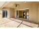 Covered outdoor patio featuring brick pavers, a ceiling fan, and an open sliding door leading into the home at 244 Dove Trl, Bradenton, FL 34212