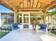 Covered back patio featuring tile flooring and seating at 2705 21St W Ave, Bradenton, FL 34205