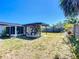 Spacious backyard with a charming gazebo and screened in porch, perfect for outdoor entertaining at 2705 21St W Ave, Bradenton, FL 34205