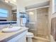 Updated bathroom with a tiled shower, modern fixtures, and ample natural light at 2705 21St W Ave, Bradenton, FL 34205