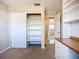 Carpeted bedroom featuring built-in shelving and closet at 2705 21St W Ave, Bradenton, FL 34205