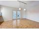 Spacious dining area with large windows and modern light fixtures at 2705 21St W Ave, Bradenton, FL 34205