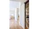 Hallway with tile flooring featuring an open closet with shelving at 2705 21St W Ave, Bradenton, FL 34205