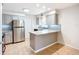Well-appointed kitchen with breakfast bar and stainless steel refrigerator at 2705 21St W Ave, Bradenton, FL 34205