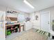 Functional laundry room with washer, dryer, utility sink, and storage solutions at 2705 21St W Ave, Bradenton, FL 34205