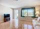 Inviting living room featuring a large window for natural light and neutral tones at 2705 21St W Ave, Bradenton, FL 34205
